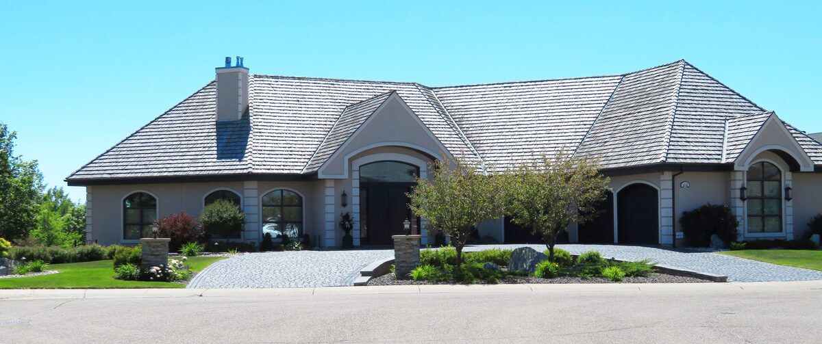 Charming residential home featuring pristine siding, clean gutters, and well-maintained grading, representing family-sized properties inspected by Northmark Property Inspections in Oconto Falls, WI.